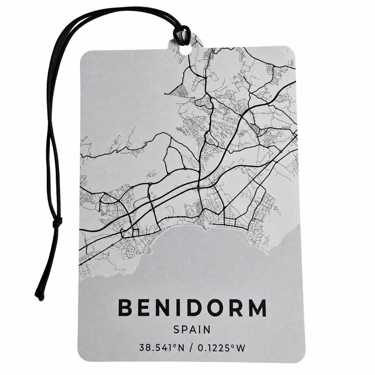 Benidorm Spain car air freshener featuring a detailed black and white street map, Mediterranean coastline, geographic coordinates and black hanging cord.