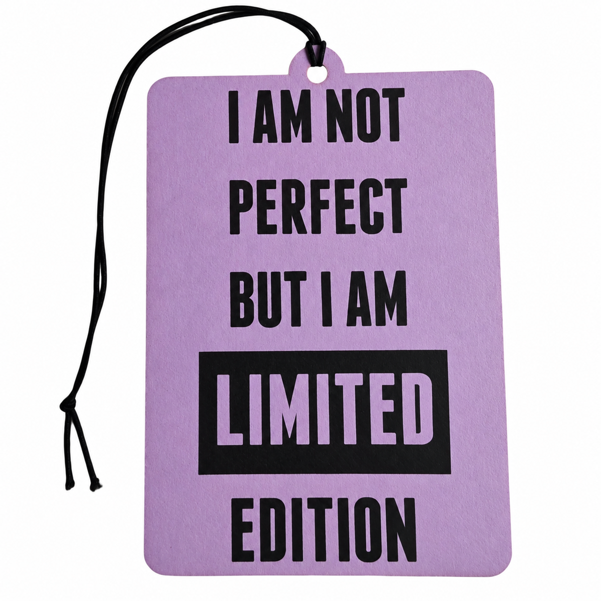 Pastel purple rectangular car air freshener featuring bold black lettering reading I Am Not Perfect But I Am Limited Edition, with a black hanging cord against a white background.