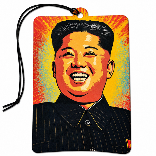A rectangular car air freshener or air freshener tag featuring a stylized pop-art portrait of Kim Jong Un, with a black hanging cord, shown on a plain white background.
