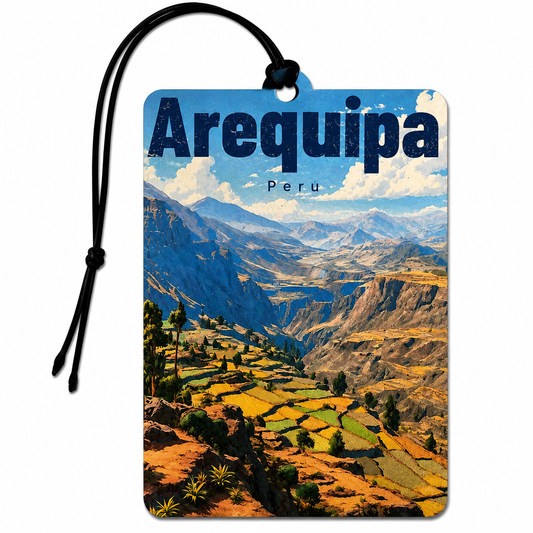 A rectangular luggage tagor car air freshener featuring a scenic print of the Andes mountains and terraced fields in Arequipa, Peru, with a black hanging cord on a white background.