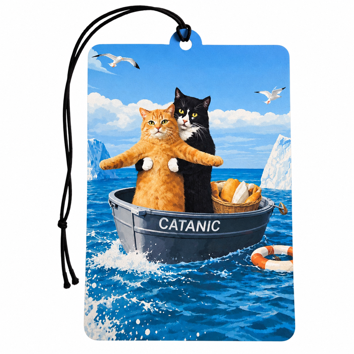 A personalized car air freshener tag featuring a custom illustration of an orange tabby cat and a black cat in a boat labeled 'CATANIC' on a blue ocean with icebergs. The tag has a black hanging cord and is shown on a plain white background.
