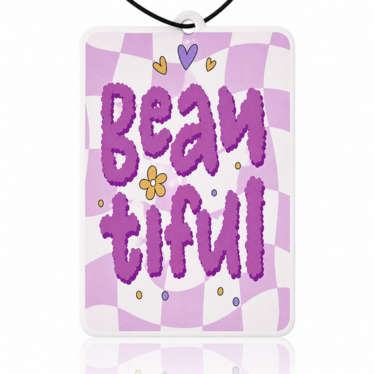 Checkered car air freshener with 'BEAUTIFUL' in purple, surrounded by decorative elements on a white background