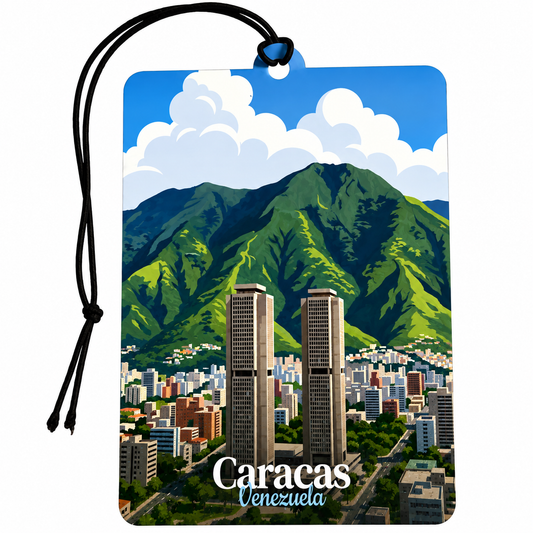 A rectangular luggage tag or car air freshener featuring a stylized illustration of Caracas, Venezuela, with green mountains, blue sky, white clouds, and city buildings. The tag has a black hanging cord and the words 'Caracas Venezuela' printed near the bottom.