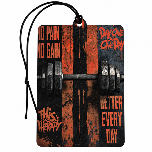 A rectangular car air freshener tag with a black hanging cord, featuring a distressed graphic design in black and orange with a barbell illustration and motivational text.