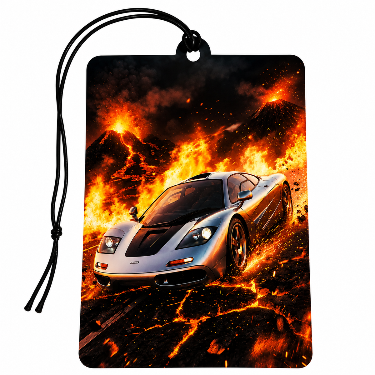 A rectangular car air freshener or luggage tag with a black hanging cord, featuring a printed graphic of a silver sports car driving through glowing lava and volcanic mountains.