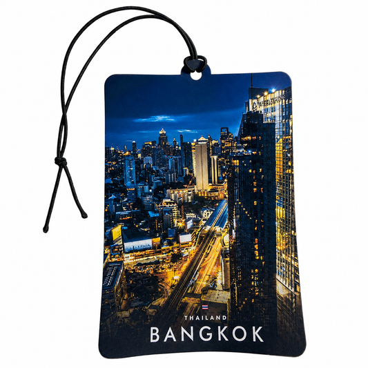 A rectangular car air freshener tag featuring a nighttime cityscape of Bangkok, Thailand, with a black hanging cord on a white background.