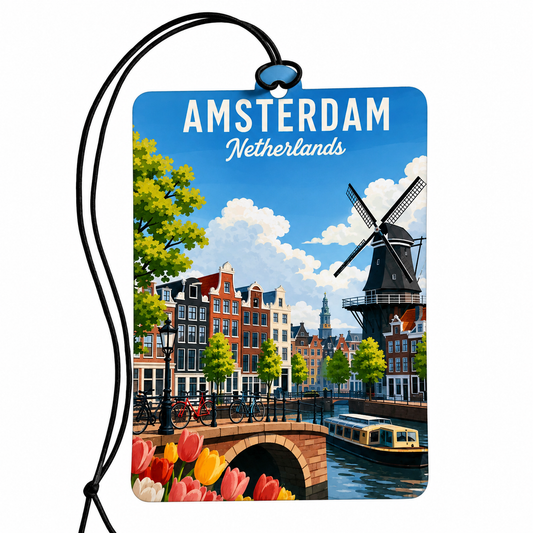 A rectangular luggage tag or car air freshener featuring a colorful Amsterdam, Netherlands travel-style illustration with the words 'AMSTERDAM Netherlands' at the top. The printed design shows a canal, buildings, a windmill, bridge, flowers, and a boat.