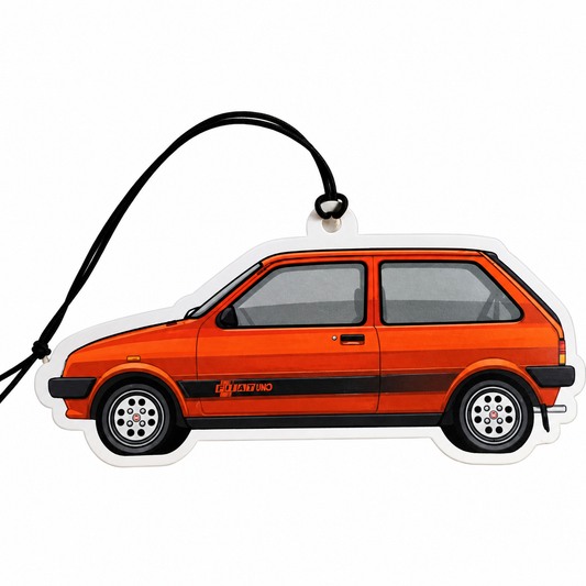 An orange fiat uno car-shaped air freshener or charm with a black hanging loop, shown in side profile on a plain white background.