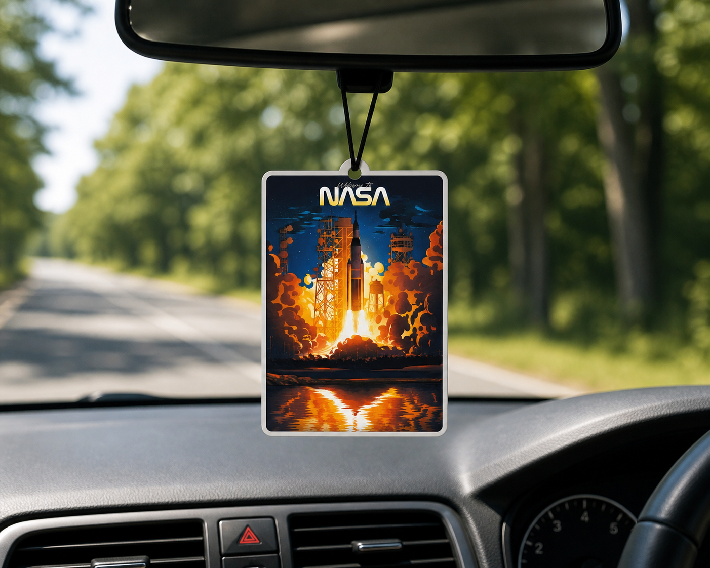 Hanging car air freshener featuring nasa rocket launching