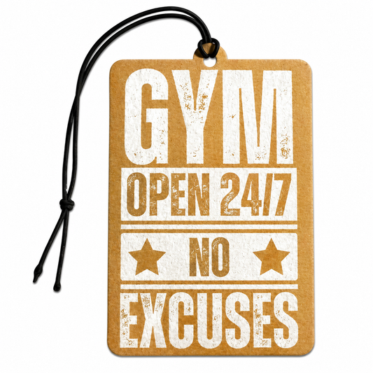 A rectangular kraft paper gym tag or car air freshener with a black hanging cord, featuring distressed white text that reads 'GYM OPEN 24/7 NO EXCUSES' with two star icons, shown on a plain white background.