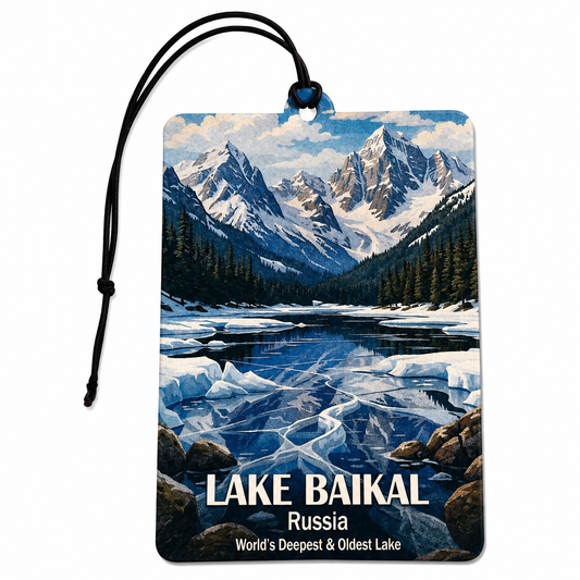 A rectangular car air freshener tag featuring a scenic illustration of Lake Baikal in Russia, with a black hanging cord and a printed landscape of snowy mountains, trees, rocks, and icy water. The text reads “LAKE BAIKAL,” “Russia,” and “World’s Deepest & Oldest Lake.