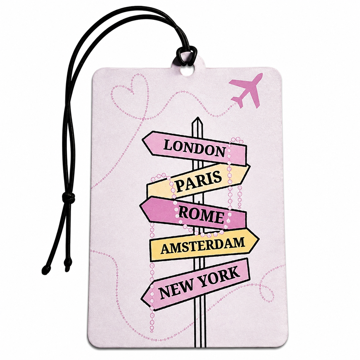 A rectangular luggage tag or car air freshener with a black hanging cord, featuring a travel signpost design with pink, yellow, and lavender directional arrows pointing to London, Paris, Rome, Amsterdam, and New York, plus a small pink airplane on a pale pink background.