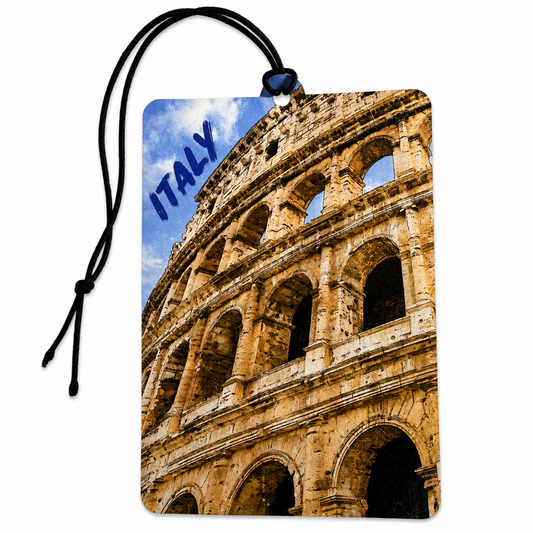 A rectangular luggage tag or Car Air Freshener featuring a printed photograph of the Roman Colosseum in Italy under a blue sky, with the word 'ITALY' printed in blue text. The tag has a black hanging cord and is shown on a plain white background.