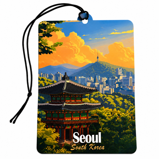 A rectangular car air freshener or luggage tag with a black hanging cord, featuring a colorful illustration of Seoul, South Korea, with a traditional pagoda, city skyline, mountains, and bright clouds. The words 'Seoul South Korea' are printed at the bottom.