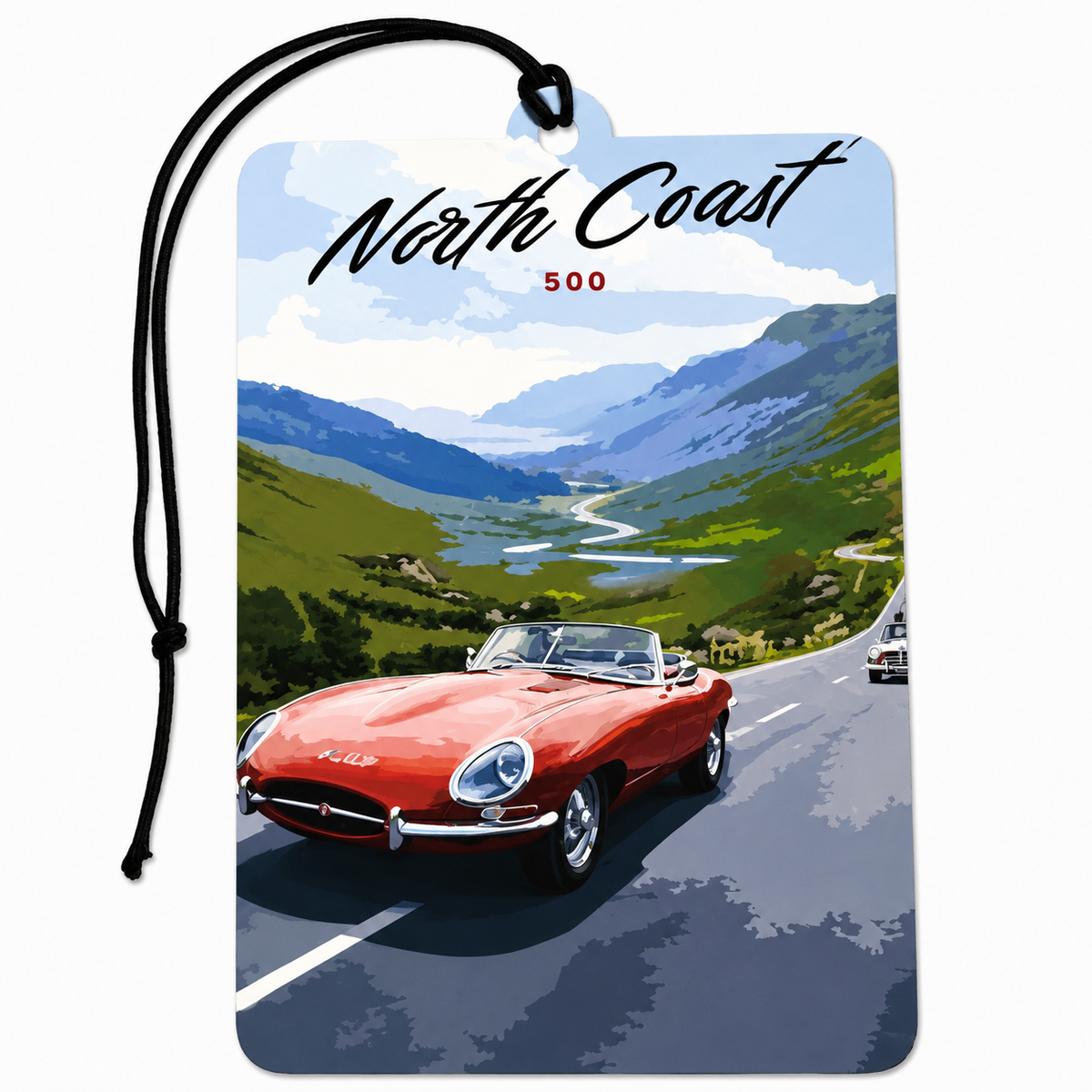 A rectangular car air freshener tag with a black hanging cord, printed with a scenic illustration of the North Coast featuring a red convertible car, green hills, mountains, and blue sky. The text 'North Coast' and '500' are printed on the tag.