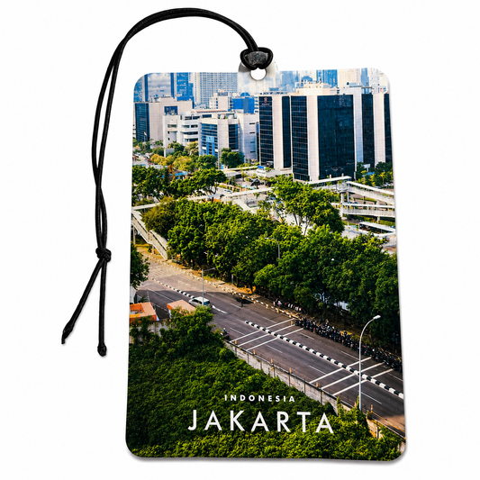 A rectangular car air freshener featuring a printed aerial photograph of Jakarta, Indonesia, with a black hanging cord and the words 'INDONESIA JAKARTA' at the bottom, shown on a plain white background.