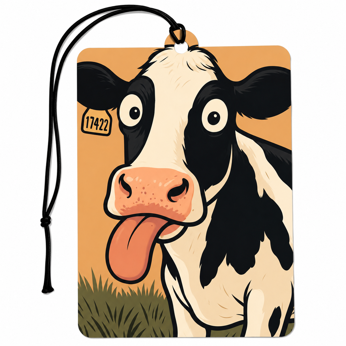 A rectangular printed car air freshener or tag with rounded corners, featuring a cartoon-style black-and-white cow with its tongue sticking out against an orange background. A black hanging cord is attached at the top, and a small tag with the number 17422 appears near the cow's left eye.