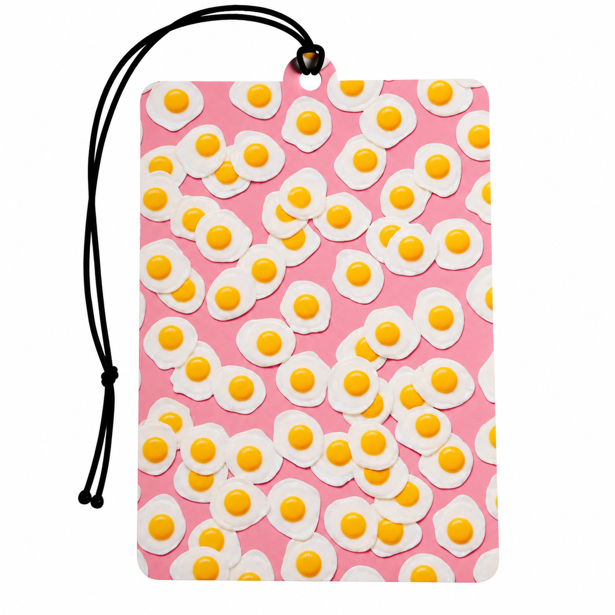 A rectangular pink car air freshener or tag with a black hanging cord, featuring a repeating pattern of 3D-effect fried eggs with white whites and yellow yolks, shown on a plain white background.