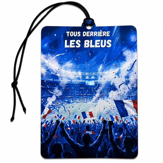 A rectangular car air freshener or air freshener tag with a black hanging cord, featuring a blue-toned graphic of a crowded soccer stadium with the French flag and the text 'TOUS DERRIÈRE LES BLEUS'.